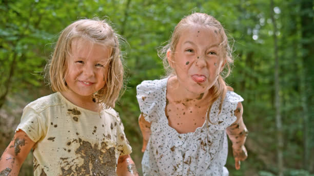 istock Girls playing in mud 1132263963