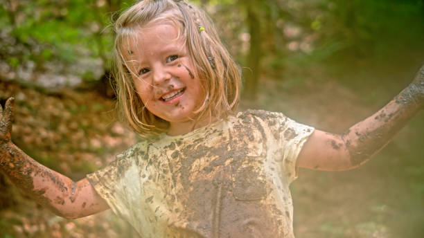 istock Girl playing in mud 1132263970