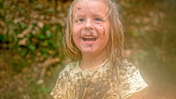 istock Girl playing in mud 1132263975