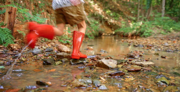 istock Girl playing in water 1132263986