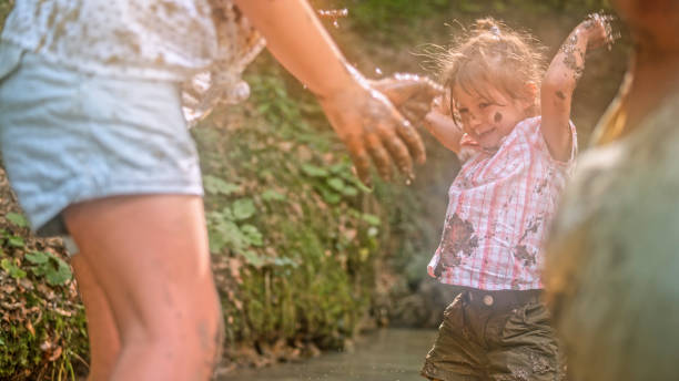 istock Girls playing in mud 1132264011