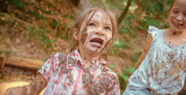 istock Girls playing in mud 1132264033