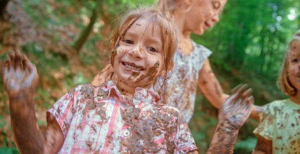 istock Girls playing in mud 1132264035