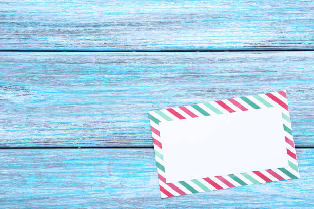 istock Handmade greeting card on blue wooden table 1132264127