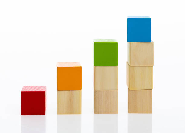 istock Wooden toy block stairs on white background 1132264332