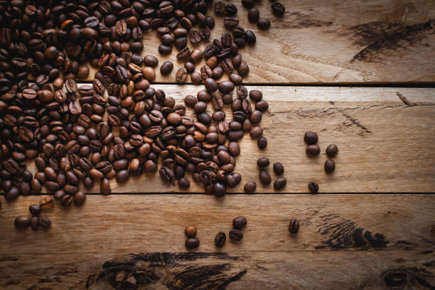 istock Coffee beans on wooden background, top view, copy space 1132264396
