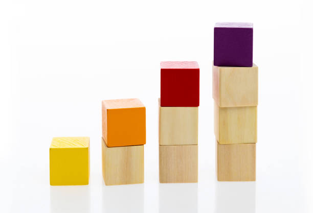 istock Wooden toy block stairs on white background 1132264593