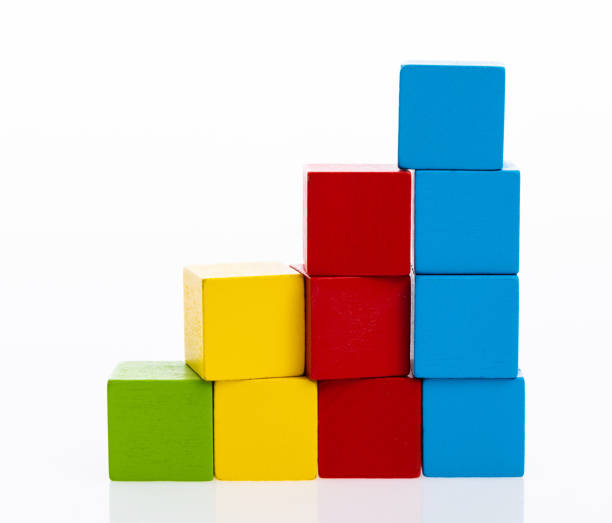 istock Wooden toy block stairs on white background 1132265454