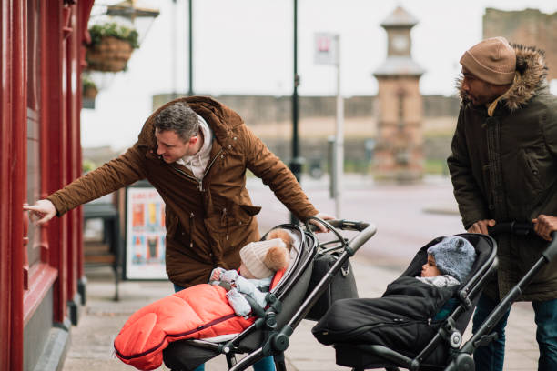 istock Window Shopping with Their Sons in Tynemouth, UK 1132265586