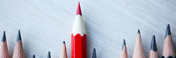 istock Red pencil standing out from crowd of 1132265661