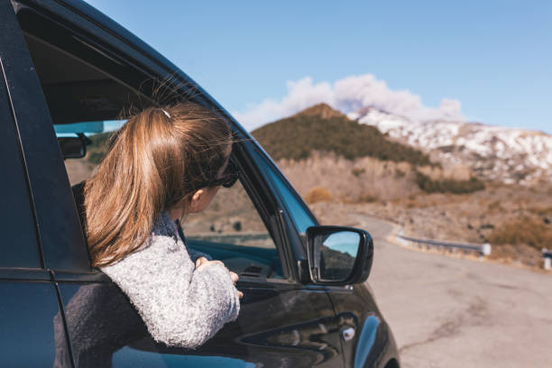 istock Sticking her head out to see the volcano 1132265867