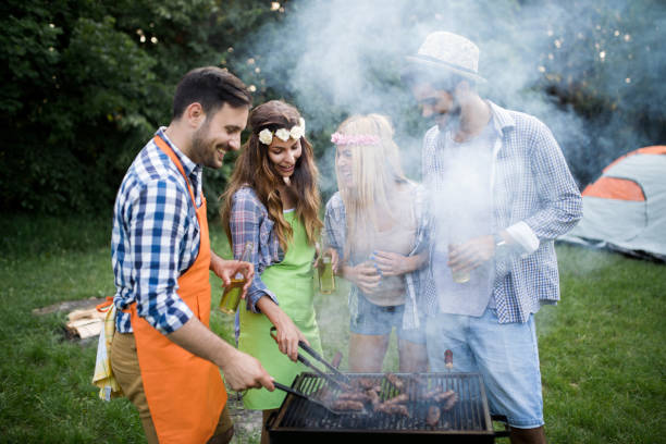 istock Friends having a barbecue party in nature 1132266325