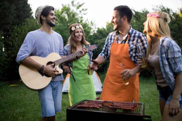 istock Group of friends having fun in nature doing bbq 1132266393