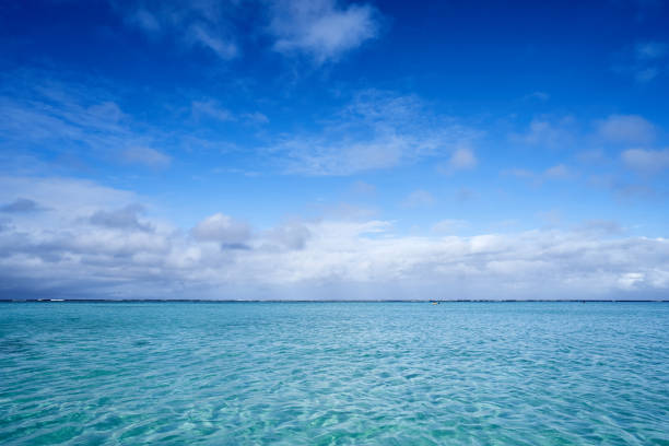 istock Emerald sea and blue sky and white clouds. 1132269406
