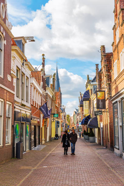 pictureseque shopping street in Enkhuizen, Netherlands Enkhuizen, Netherlands - October 09, 2016: pictureseque shopping street in Enkhuizen with unidentified people. Enkhuizen has today one of the largest marinas in the Netherlands enkhuizen stock pictures, royalty-free photos & images