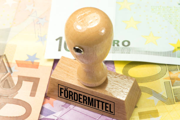 istock Euro banknotes and a stamp with the imprint funding 1132270029