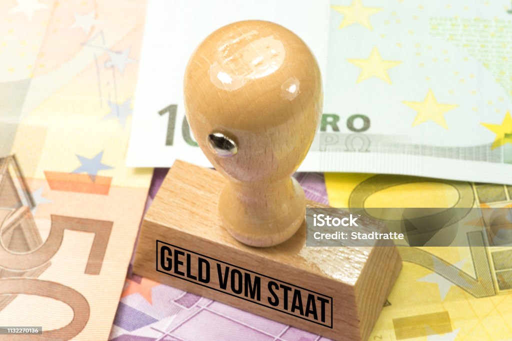 Euro banknotes and a stamp with the imprint money from the state Support Stock Photo