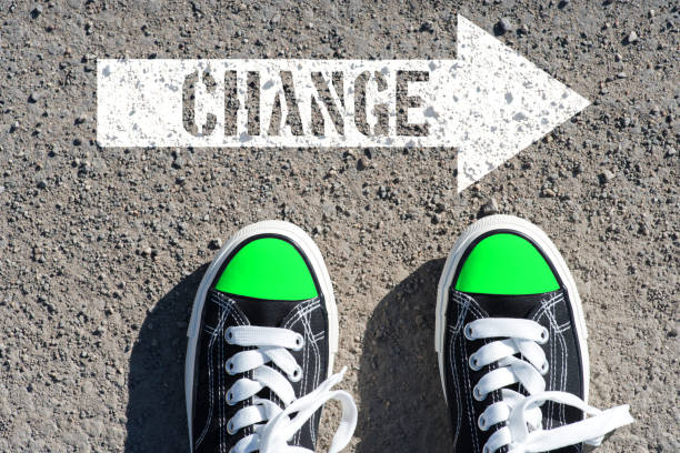 istock A man and an arrow with the word change 1132270935
