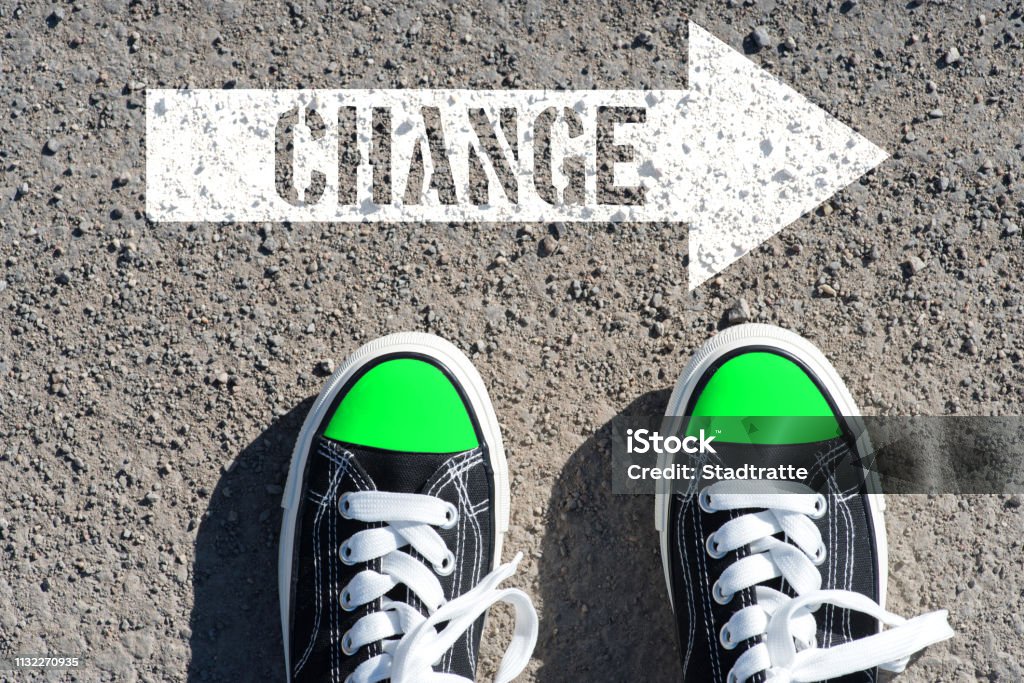A man and an arrow with the word change Adult Student Stock Photo