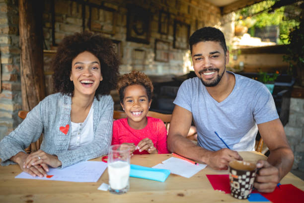 istock Gorgeous family of three doing homework together 1132271034