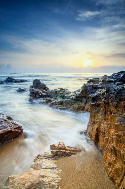 istock beautiful tropical beach sunrise sea view. soft wave hitting sandy beach 1132271404