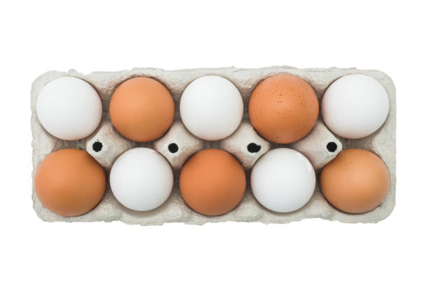 istock Chicken eggs in carton box isolated on white background. 1132271525