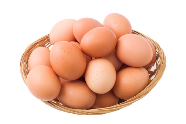 istock Chicken eggs in basket on isolated white background. 1132271538