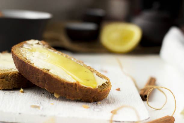 istock Pieces of bread with butter and honey, macro 1132272167