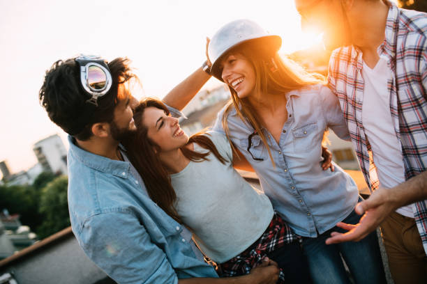 istock Group of happy friends having party on rooftop 1132273150