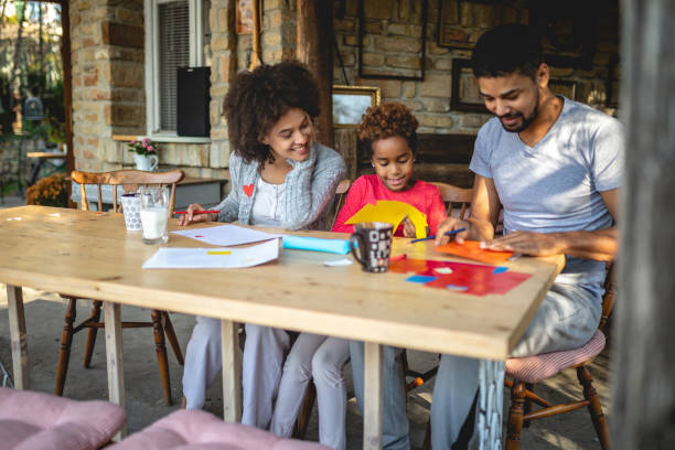 istock Creative family having fun on a house porch 1132273410