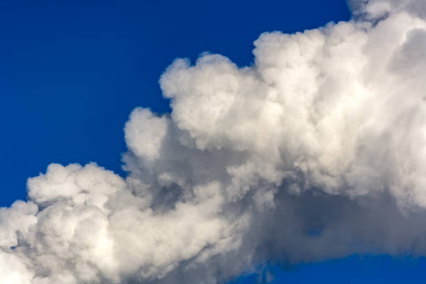 istock Thick white smoke isolated against a blue sky. Environmental pollution. Gas emissions into the atmosphere. 1132273457