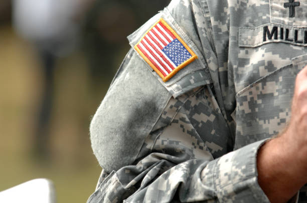 the american flag attached to the american military uniform. - tropa imagens e fotografias de stock