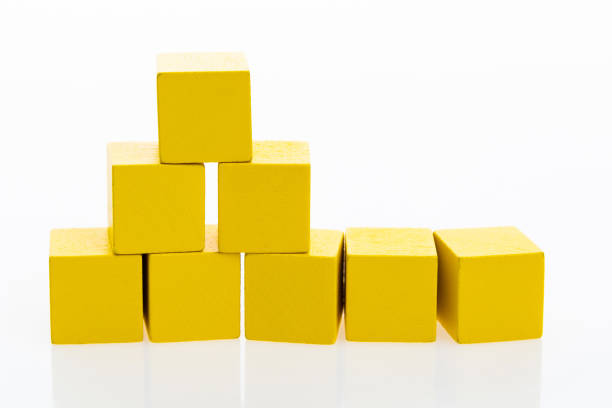 istock Pyramid of blocks on white background 1132275473