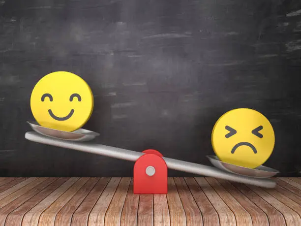 Photo of Seesaw Scale with Emoticons on Chalkboard Background - 3D Rendering