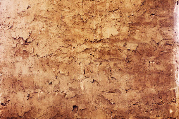 istock background from old uneven yellow-brown textural pargeting 1132279093