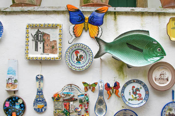 Various souvenirs for sale to tourists Touristy souvenirs for sale at the streets of Obidos, Portugal. obidos photos stock pictures, royalty-free photos & images