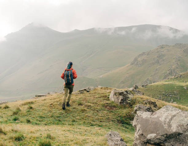 istock Hiker woman walking in the mountains. 1132281355