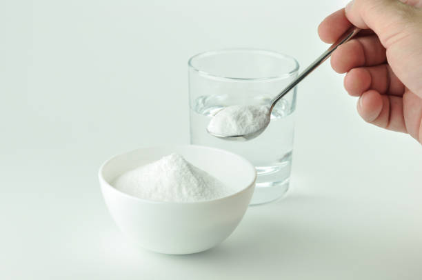 istock Baking soda and glass of water. 1132281572