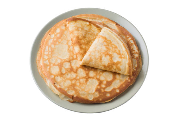 Thin pancakes on a plate isolated on a white background