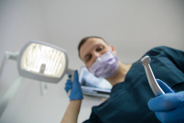 istock Dentist with dental tool from the perspective of a patient 1132281846