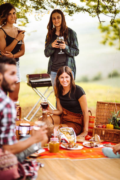 istock friends sitting on the carpet doing a bbq 1132283320