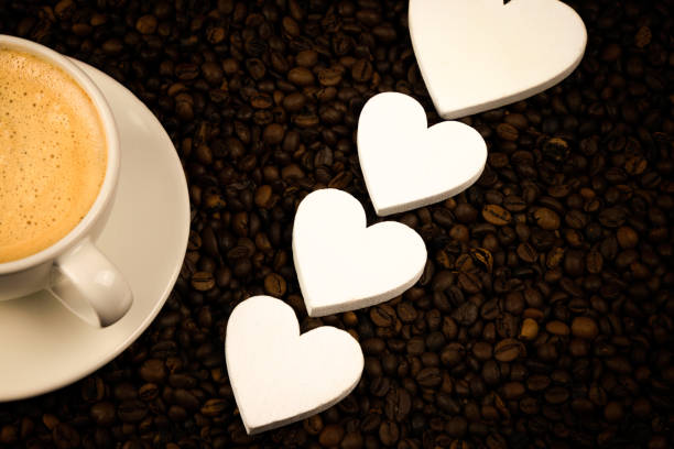 istock Espresso in white coffee with hearts and coffee beans 1132284169
