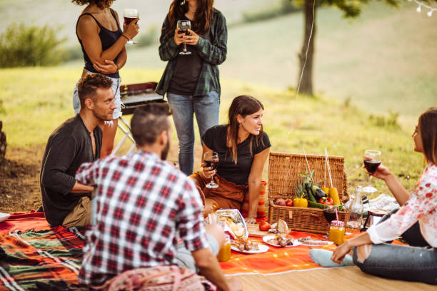 istock friends sitting on the carpet doing a bbq 1132284619