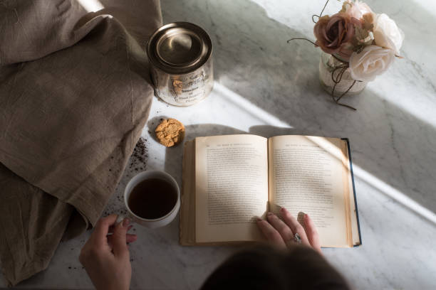 Young woman drinking her cup of coffee while having a coffee