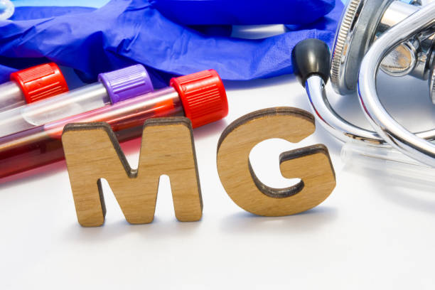 MG abbreviature mean Magnesium electrolyte with lab tubes with blood and stethoscope. Using acronym MG in laboratory clinical diagnosis, determination of pathologies contacts to deficiency MG abbreviature mean Magnesium electrolyte with lab tubes with blood and stethoscope. Using acronym MG in laboratory clinical diagnosis, determination of pathologies contacts to deficiency magnesium deficiency stock pictures, royalty-free photos & images