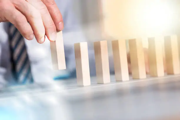 Photo of Concept of business progress with wood blocks, light effect