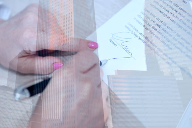 istock Woman signing a contract, double exposure 1132287003