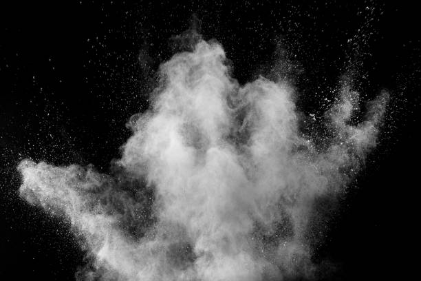 istock White powder explosion cloud against black background.White dust particles splash. 1132287123