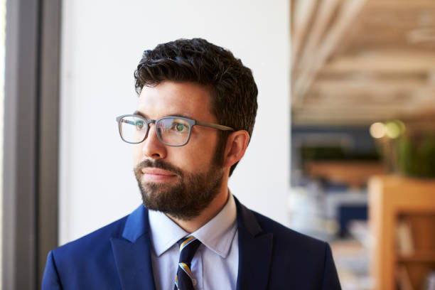 istock Businessman In Modern Office Standing By Window 1132288490