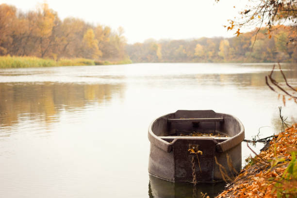 istock wooden boat on the river, 1132288953